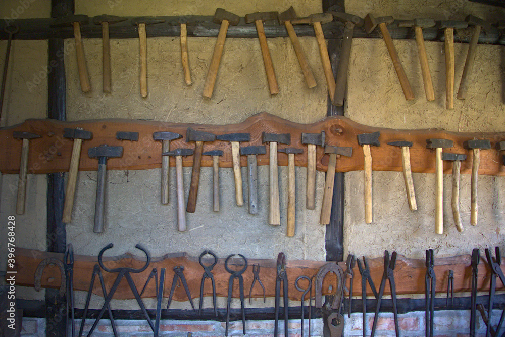A wall fitted with a blacksmiths equipment