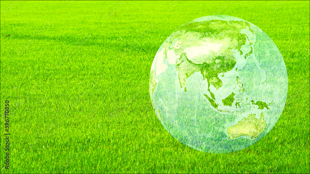 earth and asia map on the green field, ecology afforestation, climate change concept earth and asia map on the green field, ecology afforestation, climate change concept
