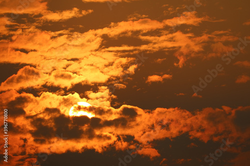 beautiful sunset red orange yellow silhouette dark sky in back on cloud