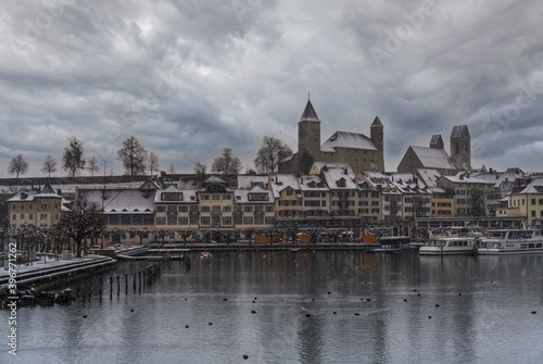First day of advent with snow over the harbor of the old city of Rapperswil (Rappi), St. Gallen, Switzerland