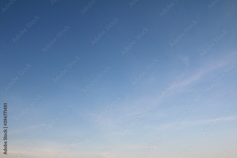 Blue sky background with white clouds.	