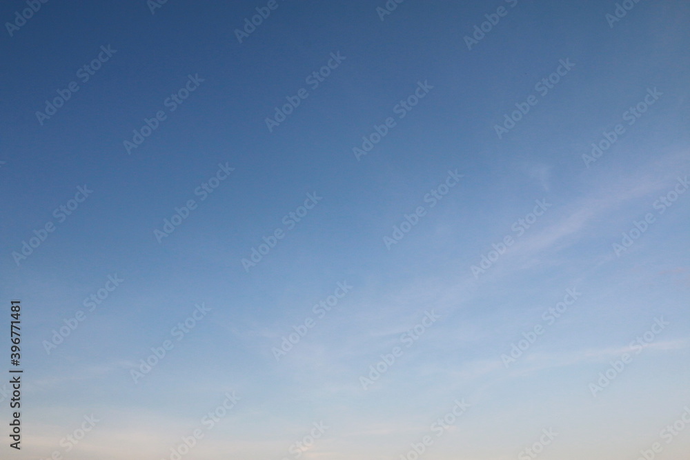 Fototapeta premium Blue sky background with white clouds. 