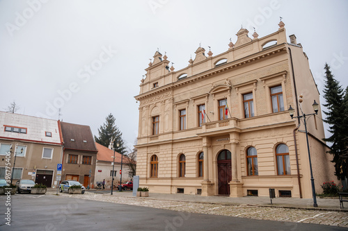 Historical neo renaissance building of city hall at main town Husovo Square at cloudy autumn day, Cesky Brod, Central Bohemia, Czech Republic © AnnaRudnitskaya