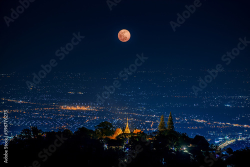 the Last Penumbral Lunar Eclipse in 2020 over Wat Phrathat Doi Suthep Temple , Chiang mai , Thailand