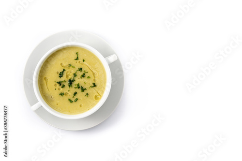 Fresh green asparagus soup in bowl isolated on white background.Top view.Copy space
