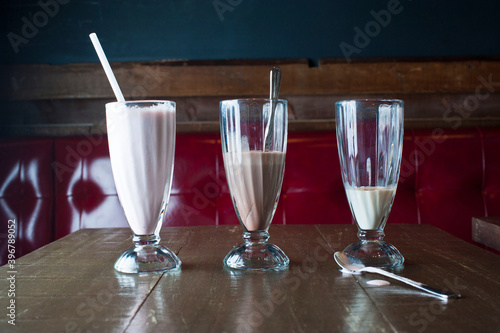 Milkshakes or Fruit smoothies. Classic America favorite: chocolate, vanilla or strawberry ice cream, milk, fruits and ice blended and served in milk shake glasses. Traditional diner drink.