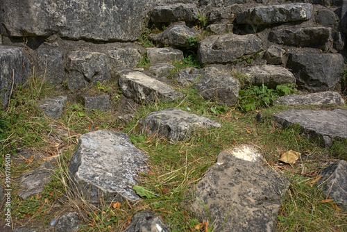 Obraz na płótnie low angle view of rocks from ruins on a grassy ground w salonie