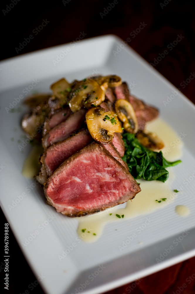 Steak and potatoes. Grade A grass fed angus beef steaks. Tenderloin, filet mignon, New York strip, bone in rib-eye grilled medium rare on outdoor wood-fired grill. Classic American steakhouse entree. Steak and potatoes. Grade A grass fed angus beef steaks. Tenderloin, filet mignon, New York strip, bone in rib-eye grilled medium rare on outdoor wood-fired grill. Classic American steakhouse entree.