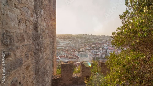 Time lapse of panoramic view of lisbon or lisboa during a sunny cloudy day from the Saint Jeorge castle . There is the capital or portugal in close up with tagus or tago river in background photo