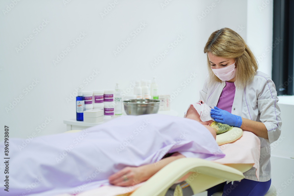 Woman beautician doctor at work in spa center. Portrait of a young female professional cosmetologist. Healthcare occupation, medical career. soft focus Woman beautician doctor at work in spa center. Portrait of a young female professional cosmetologist. Healthcare occupation, medical career. soft focus