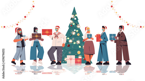colleagues in santa hats holding gifts mix race office workers celebrating new year and christmas holidays horizontal full length isolated vector illustration