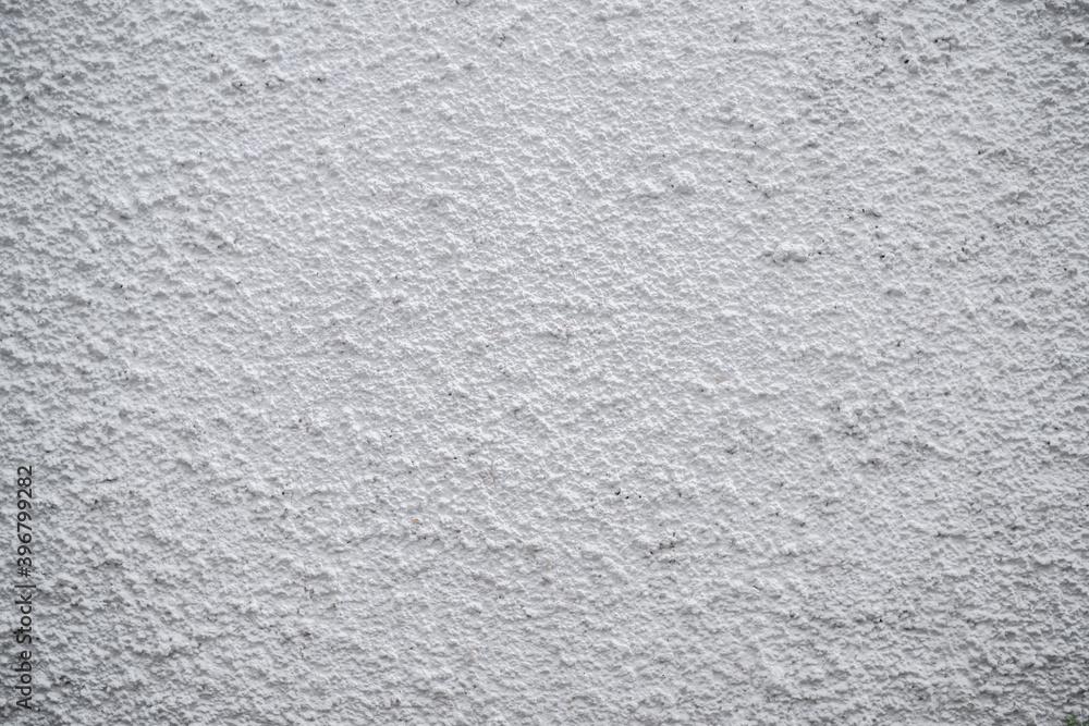 White concrete wall with rustic natural texture for abstract background texture and design purpose White concrete wall with rustic natural texture for abstract background texture and design purpose