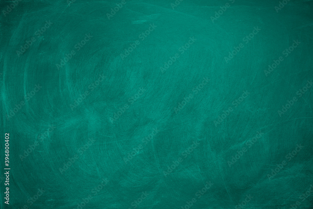 Group of colorful chalk rubbed out on blackboard or chalkboard background,  can be use as concept for school education, dark wall backdrop , design  template , etc. Stock Photo