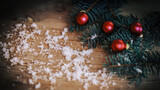 Christmas background.Christmas tree branch with balls on wooden