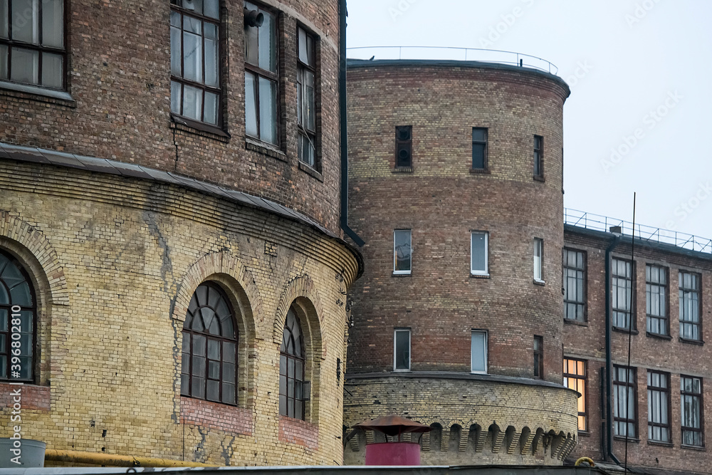 Western facade with towers of the old historic building of the Arsenal plant in center of Kyiv, Ukraine. November 2020 Western facade with towers of the old historic building of the Arsenal plant in center of Kyiv, Ukraine. November 2020