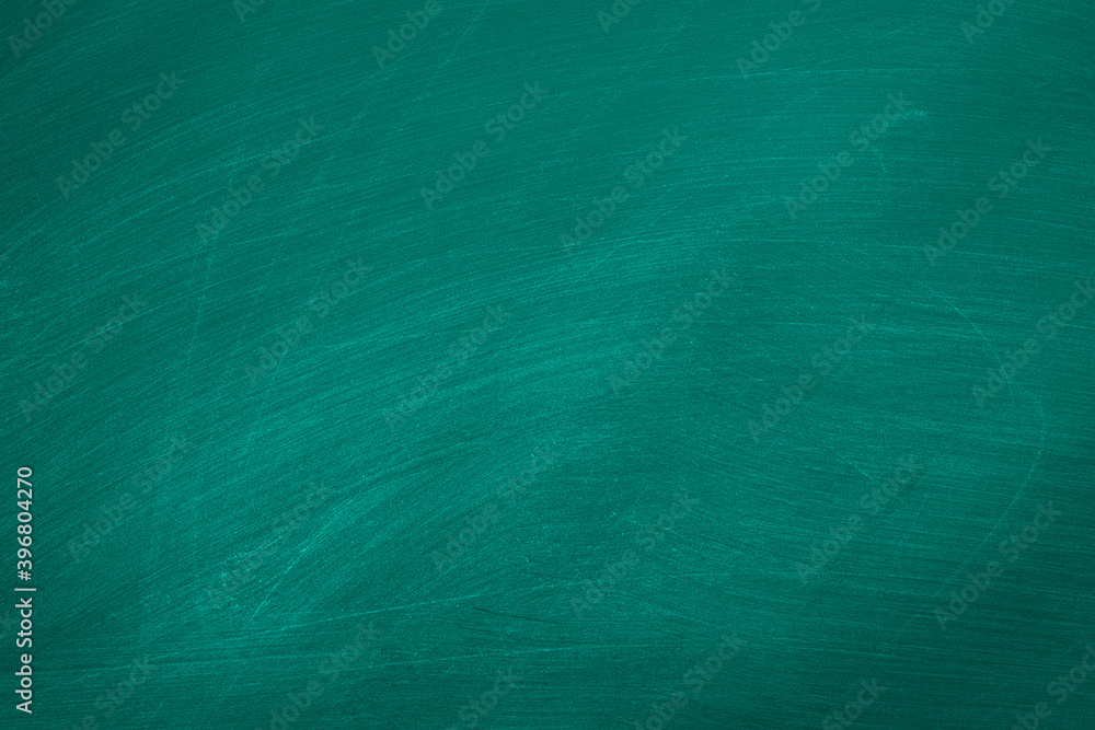 Abstract texture of chalk rubbed out on green blackboard or chalkboard background. School education, dark wall backdrop or learning concept. Abstract texture of chalk rubbed out on green blackboard or chalkboard background. School education, dark wall backdrop or learning concept.