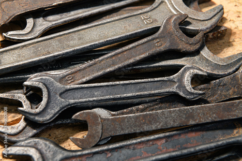 old vintage hand tools - set of wrenches on a wooden background © soleg
