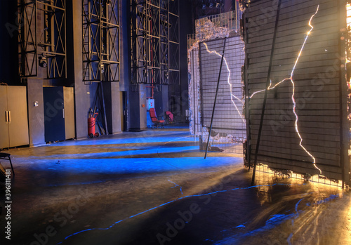 View from  the backstage of a theater, a blue lights brakes through the decorati Fototapeta