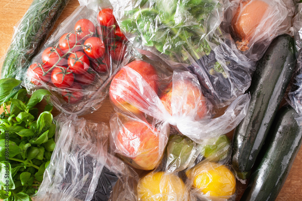 single use plastic waste issue. fruits and vegetables in plastic bags