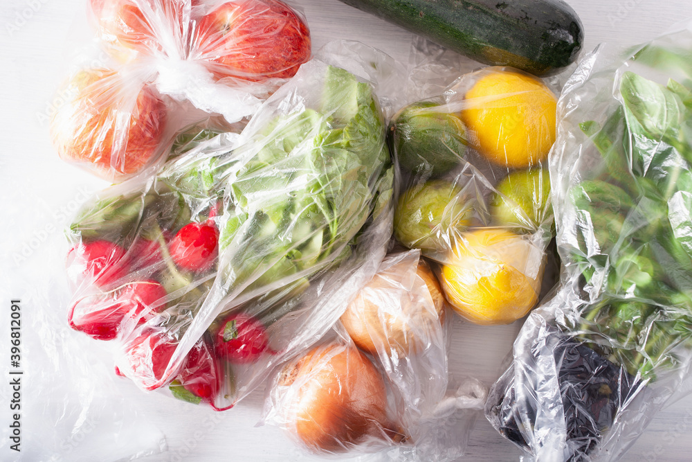 single use plastic waste issue. fruits and vegetables in plastic bags