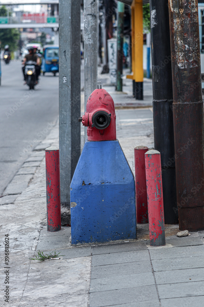 hydrant pillar in red and foundation in blue