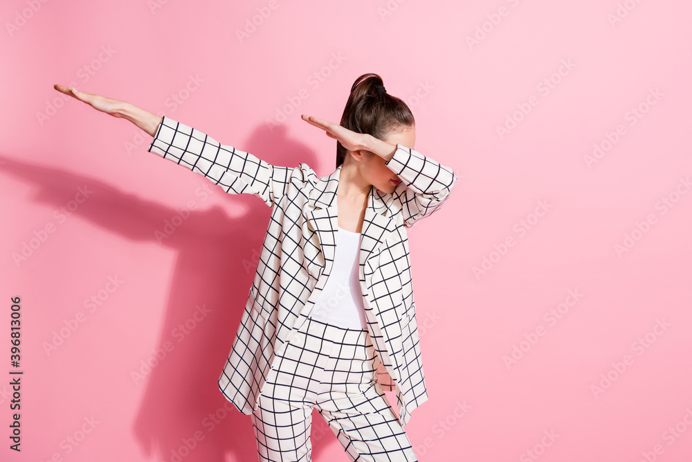 Fototapeta premium Photo of young attractive woman enjoy music party make dab movement wear jacket isolated over pastel color background