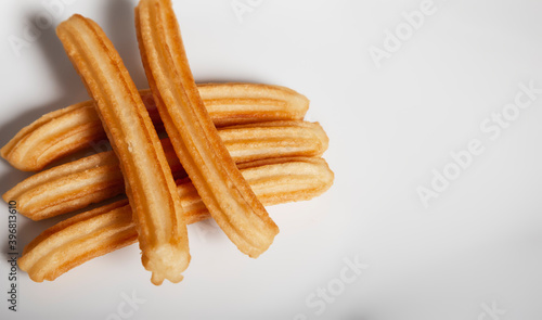 Various churros on white background with copy space for text