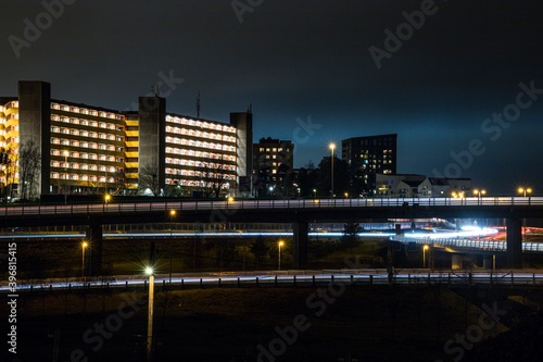 Stockholm  Sweden Apartment buildings and highway in the  Rinkeby suburb at  night.