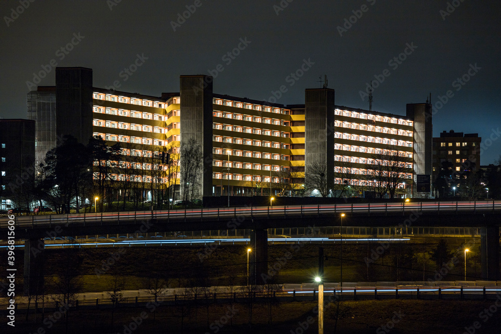 Fototapeta premium Stockholm, Sweden Apartment buildings and highway in the Rinkeby suburb at night.