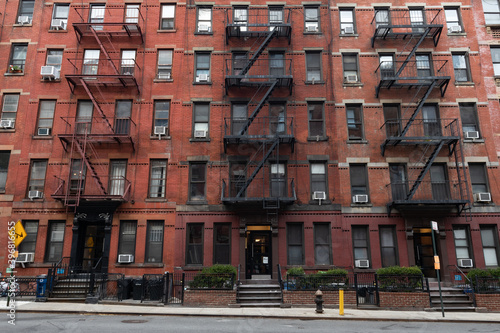 Photography Row of Old Brick Apartment Buildings along an Empty Street in Hell's Kitchen of