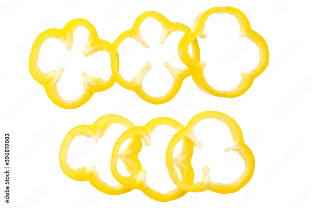 Yellow sweet bell pepper slices isolated on white background. Top view. Yellow sweet bell pepper slices isolated on white background. Top view.