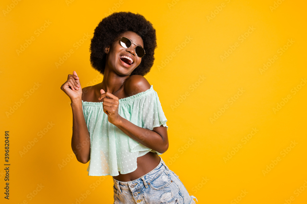 Photo portrait of girl dancing isolated on vivid yellow colored background with blank space Photo portrait of girl dancing isolated on vivid yellow colored background with blank space