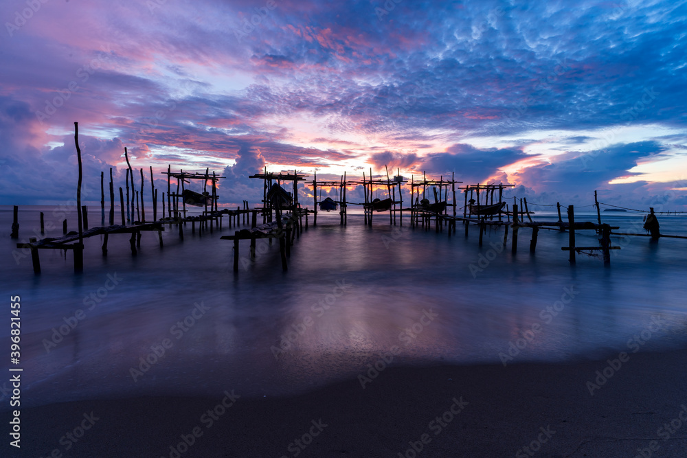 Morning view before sunrise Fishing boat's harbor service at Bang Hoi Beach, Songlkhla, Thailand.