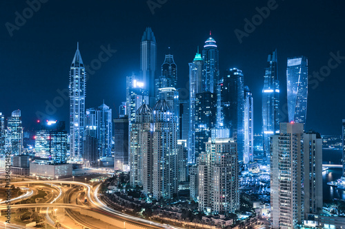 Cityscape and skyline at night in Dubai Marina. 