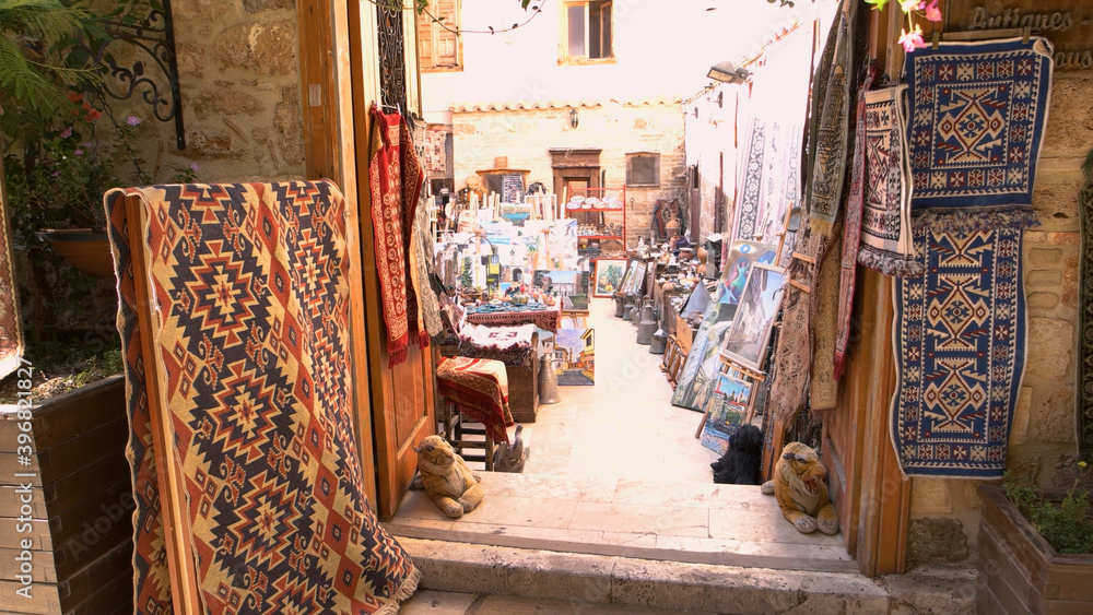 Carpet shop at the street market. Turkish handmade souvenirs for sale at outdoor market. Kaleici, Antalya, Turkey.