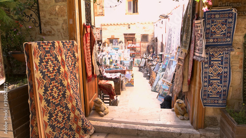Carpet shop at the street market. Turkish handmade souvenirs for sale at outdoor market. Kaleici, Antalya, Turkey. © DenisProduction.com