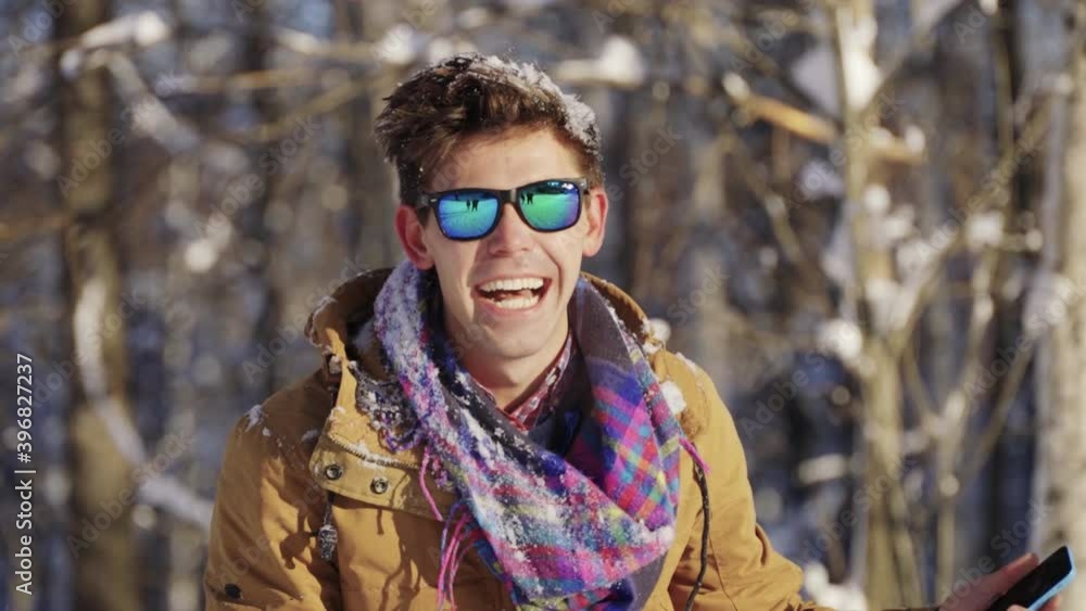 Happy guy throwing snow up in front of camera. Winter mood. Winter, sport, holidays, xmas, lifestyle concept. Filmed on cinema camera, 10 bit color space. Happy guy throwing snow up in front of camera. Winter mood. Winter, sport, holidays, xmas, lifestyle concept. Filmed on cinema camera, 10 bit color space.