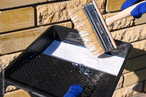 . A natural stone covered with a protective liquid from moisture and mold. Protect the stone from moisture. Drops of water on a rock. Hydrophobicity.