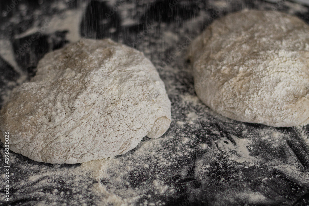 Unbaked sourdough bread on a table Unbaked sourdough bread on a table