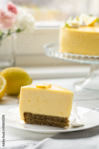 Dessert - Lemon mouse  Cheesecake. A slice of citrus cake with lemon and orange. half a lemon cake. cutaway lemon cake. sponge cake