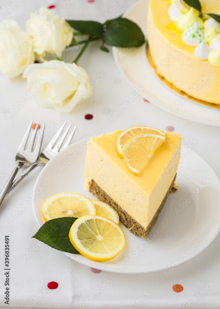 Dessert - Lemon mouse Cheesecake. A slice of citrus cake with lemon and orange. half a lemon cake. cutaway lemon cake. sponge cake Dessert - Lemon mouse Cheesecake. A slice of citrus cake with lemon and orange. half a lemon cake. cutaway lemon cake. sponge cake