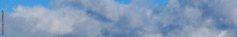 Blue sky with clouds, wide cloudscape background panorama Blue sky with clouds, wide cloudscape background panorama