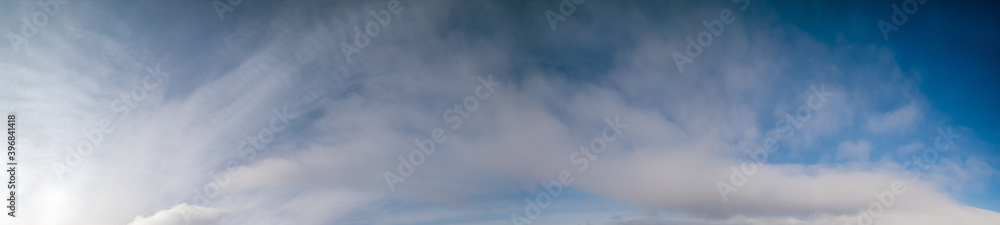 Fluffy clouds in evening overcast sky view. Climate, environment and weather concept sky background. Fluffy clouds in evening overcast sky view. Climate, environment and weather concept sky background.