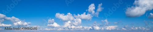 Blue sky with clouds, wide cloudscape background panorama © wildman