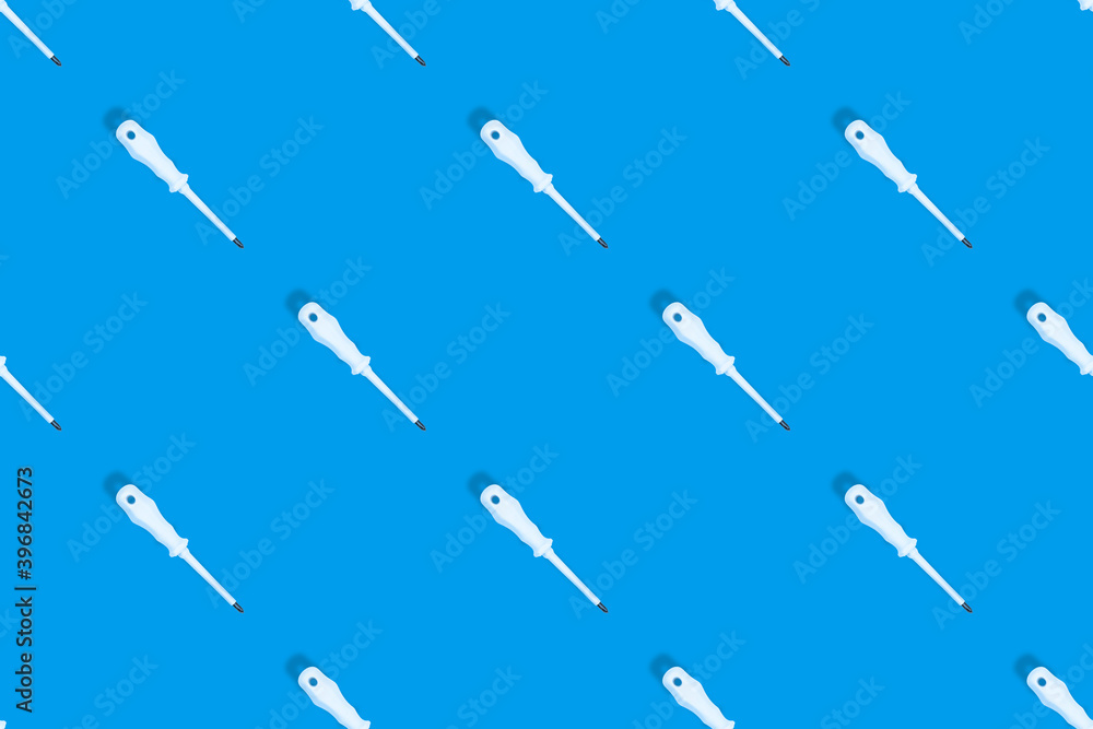 Metal screwdriver with rubber pads.Screwdriver seamless pattern. Metal screwdriver with rubber pads.Screwdriver seamless pattern.