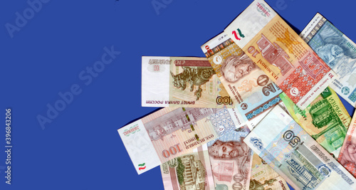 Photo of rubles bank notes from Russia  pounds bank notes  euro banknotes  dollars on blue background. Money consept