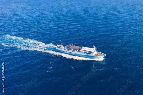 Aerial drone view of a passenger ship, blue sea background. © Rawf8