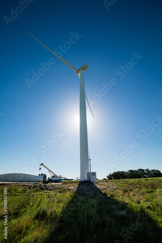 Shadow of a big modern windmill at Uruguay´s countryside photo