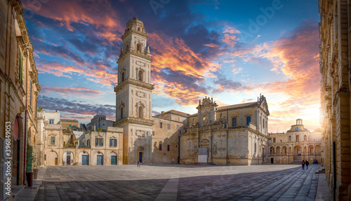 Panorama of Lecce, Puglia, Italy at sunset. Piazza del Duomo square, Campanile tower and Virgin Mary Cathedral (Basilica di Santa Maria Assunta in Cielo), Caritas Diocesana. Baroque city of Apulia photo