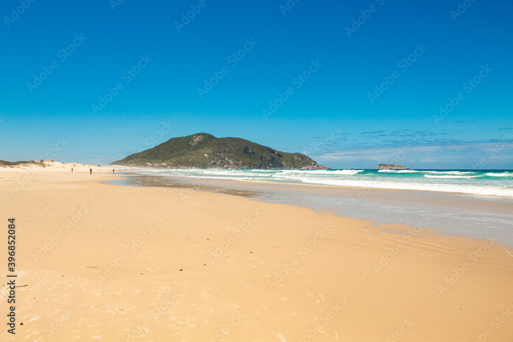 Sunny day at the tropical beach in southern Brazil, Florianópolis island, Santinho beach, Florianopolis, Santa Catarina Sunny day at the tropical beach in southern Brazil, Florianópolis island, Santinho beach, Florianopolis, Santa Catarina